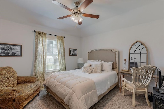bedroom with a ceiling fan and carpet floors
