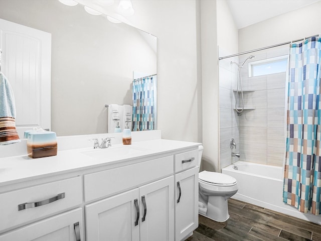 full bathroom with shower / bath combo with shower curtain, wood finished floors, toilet, and vanity