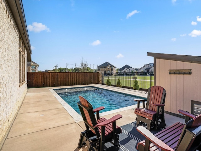 view of pool with a fenced in pool, a patio, and a fenced backyard