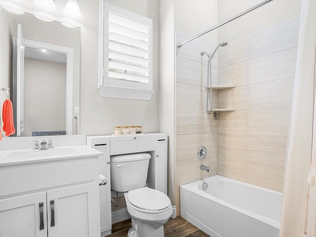 bathroom featuring shower / tub combination, wood finished floors, toilet, and vanity
