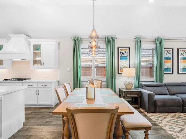 dining area featuring dark wood-type flooring and recessed lighting