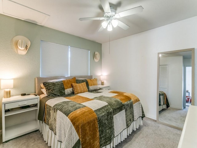 bedroom with a ceiling fan, carpet flooring, and baseboards