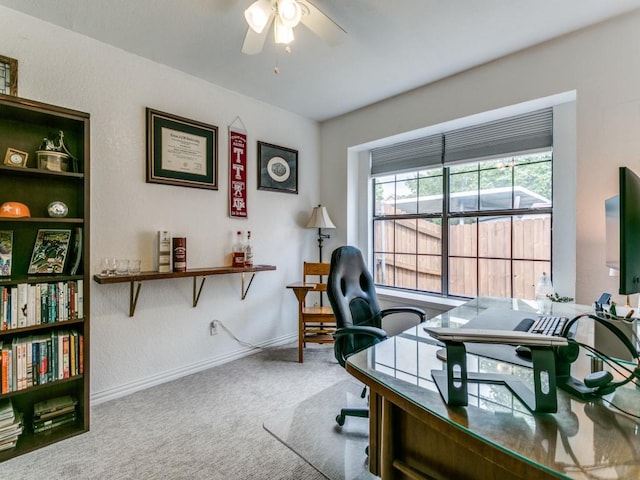office with baseboards, a ceiling fan, and carpet flooring