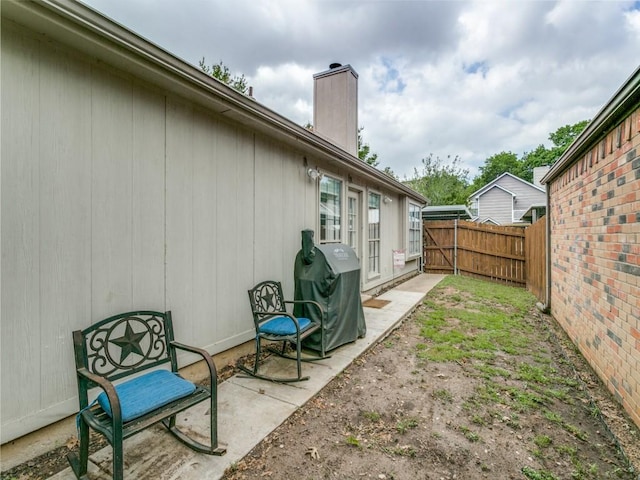 view of yard with fence and a patio area