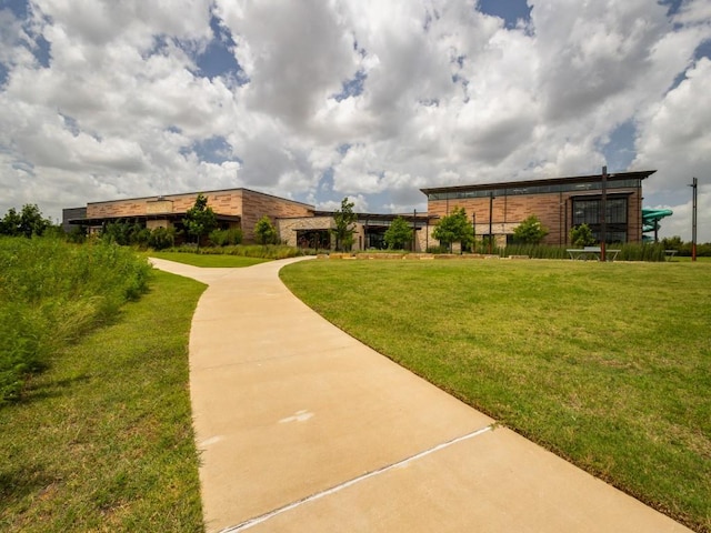 surrounding community featuring a yard