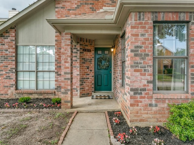 property entrance with brick siding