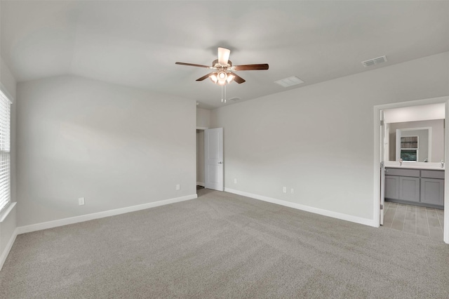 unfurnished bedroom with visible vents, baseboards, and light carpet
