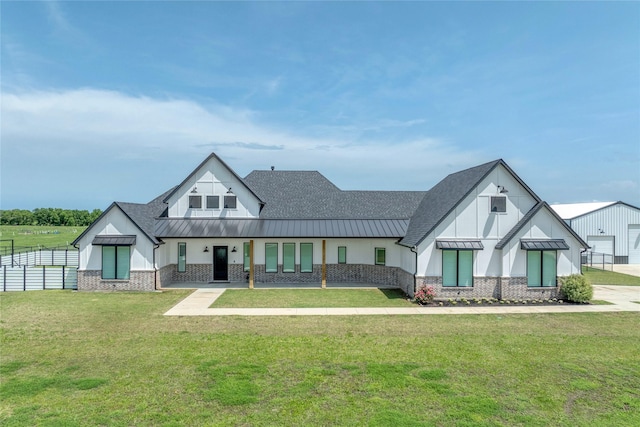 450 County Road 2411, Valley View, TX 76272 - view of front of property featuring a standing seam roof, a front lawn, metal roof, board and batten siding, and fence