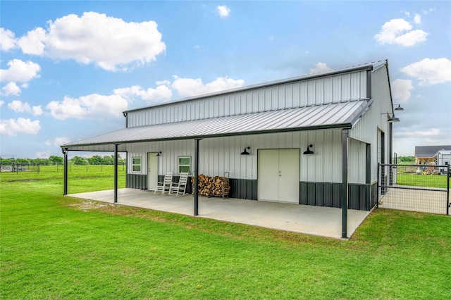 450 County Road 2411, Valley View, TX 76272 - rear view of house with board and batten siding, metal roof, an outbuilding, a lawn, and fence