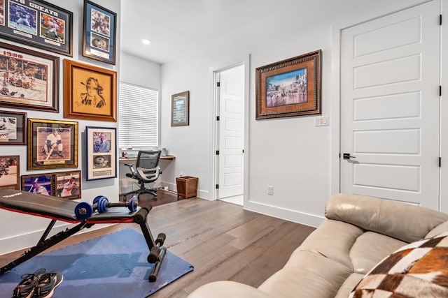 workout area with recessed lighting, wood finished floors, and baseboards