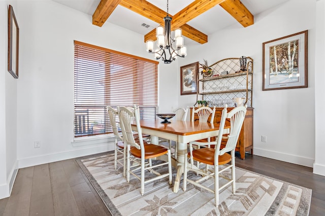 dining room with beamed ceiling, a notable chandelier, and baseboards