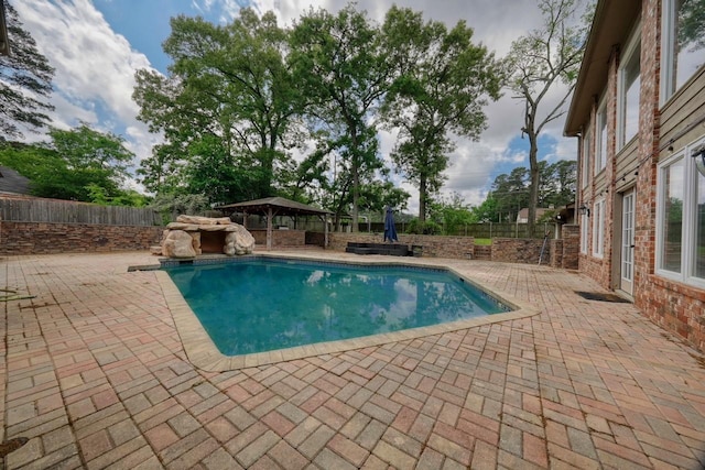 view of swimming pool featuring a gazebo, a fenced backyard, a patio, and a fenced in pool