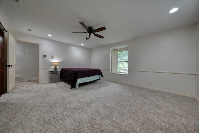 bedroom featuring light colored carpet, ceiling fan, recessed lighting, and baseboards