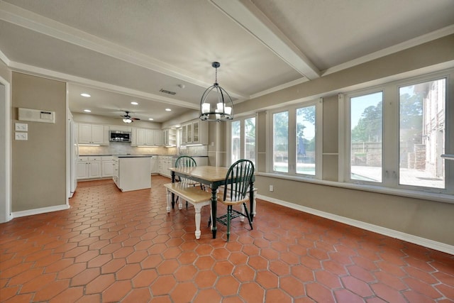 tiled dining area featuring recessed lighting, beamed ceiling, and baseboards