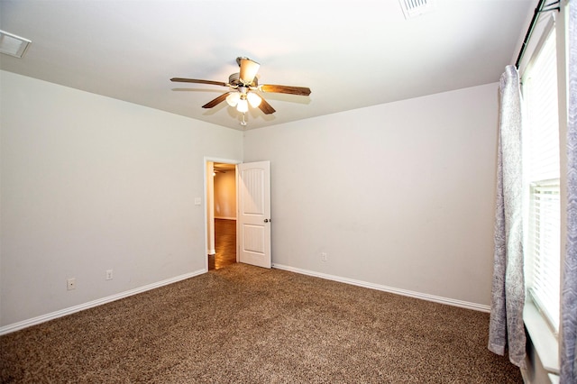 2811 W Washington St, Denison, TX 75020 - carpeted empty room with visible vents, a ceiling fan, and baseboards