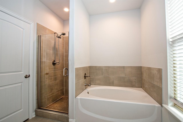 2811 W Washington St, Denison, TX 75020 - full bath featuring recessed lighting, a stall shower, and a garden tub