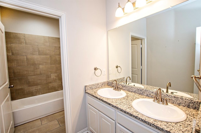 2811 W Washington St, Denison, TX 75020 - full bathroom featuring double vanity and a sink