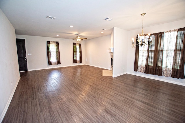 2811 W Washington St, Denison, TX 75020 - interior space featuring baseboards, visible vents, dark wood-type flooring, and a fireplace