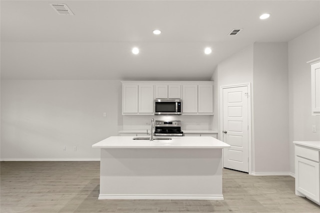 3246 Baehr, Royse City, TX 75189 - kitchen with stainless steel appliances, light countertops, light wood finished floors, an island with sink, and white cabinetry