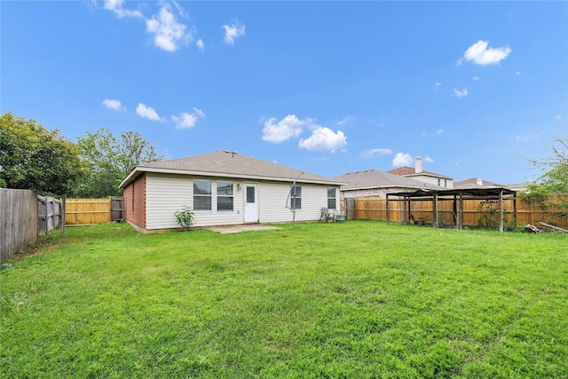 back of house featuring a gazebo, a yard, and a fenced backyard