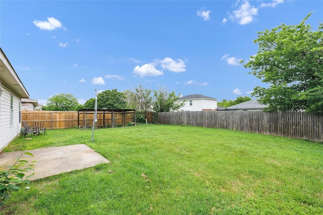 view of yard featuring a patio and a fenced backyard