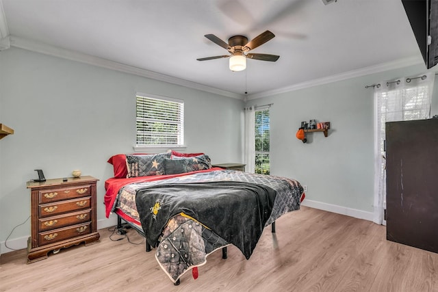 bedroom with baseboards, ornamental molding, a ceiling fan, and wood finished floors