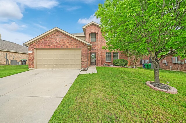traditional-style house featuring cooling unit, concrete driveway, a front yard, brick siding, and a garage