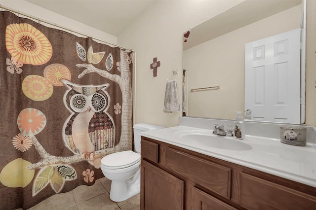 bathroom with vanity, toilet, and tile patterned flooring