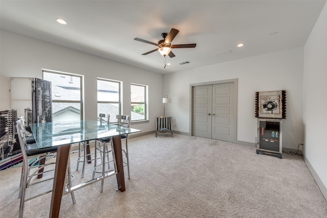 interior space featuring recessed lighting, a ceiling fan, visible vents, and baseboards