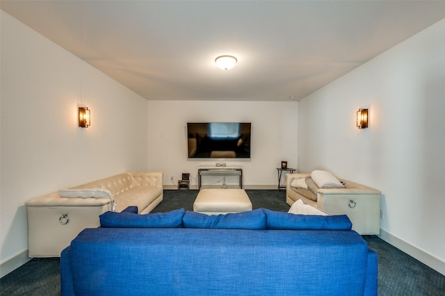 living room featuring baseboards and dark carpet