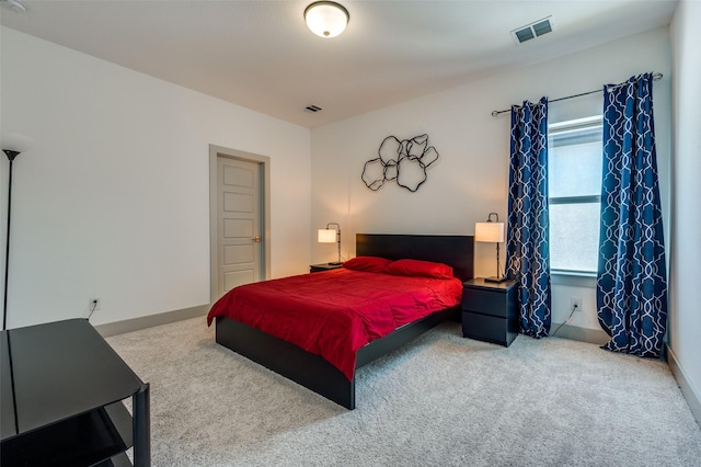 bedroom featuring carpet flooring, visible vents, and baseboards