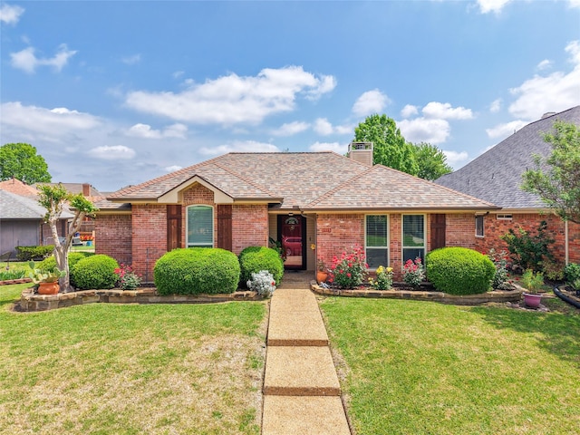 1515 Brighton Dr, Carrollton, TX 75007 - ranch-style home featuring a chimney, brick siding, a front yard, and roof with shingles