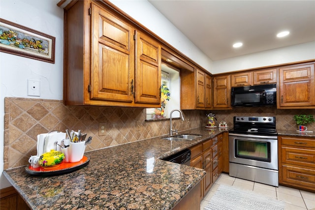1515 Brighton Dr, Carrollton, TX 75007 - kitchen featuring light tile patterned floors, black appliances, a sink, and brown cabinets
