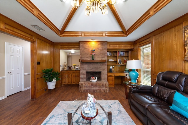 1515 Brighton Dr, Carrollton, TX 75007 - living area featuring lofted ceiling with beams, an inviting chandelier, dark wood-style flooring, a fireplace, and visible vents
