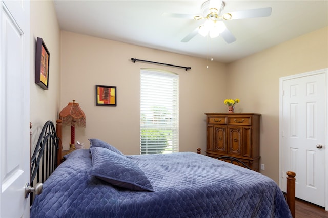 1515 Brighton Dr, Carrollton, TX 75007 - bedroom with ceiling fan and dark wood finished floors