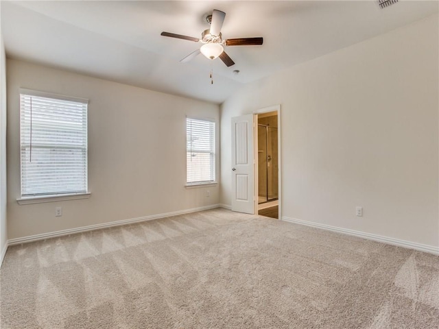 empty room featuring a ceiling fan, carpet flooring, and baseboards
