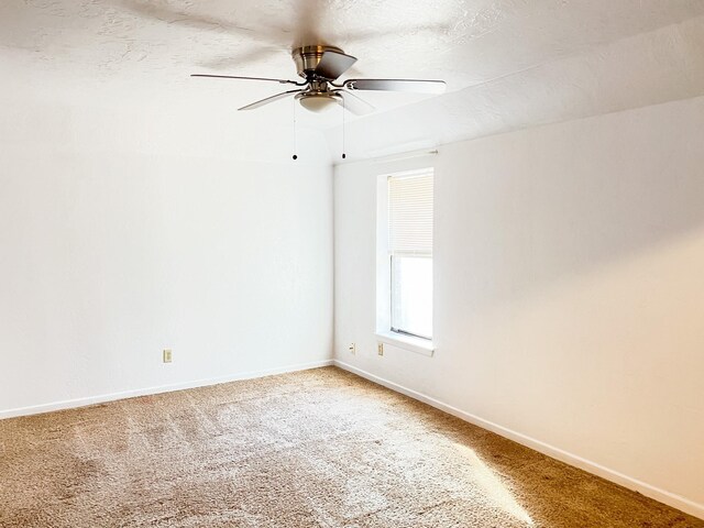 505 N Yosemite, Iowa Park, TX 76367 - unfurnished room featuring baseboards, light carpet, and ceiling fan