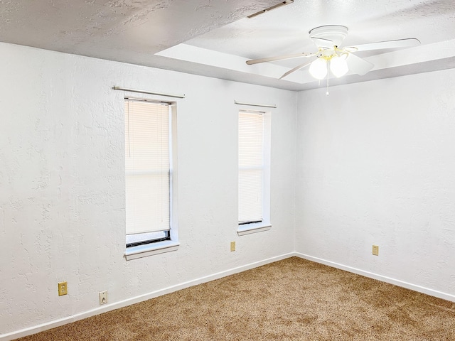 505 N Yosemite, Iowa Park, TX 76367 - unfurnished room with a ceiling fan, carpet flooring, a textured wall, and baseboards
