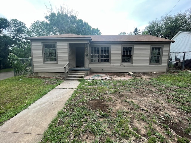 view of front of property with fence and a front yard