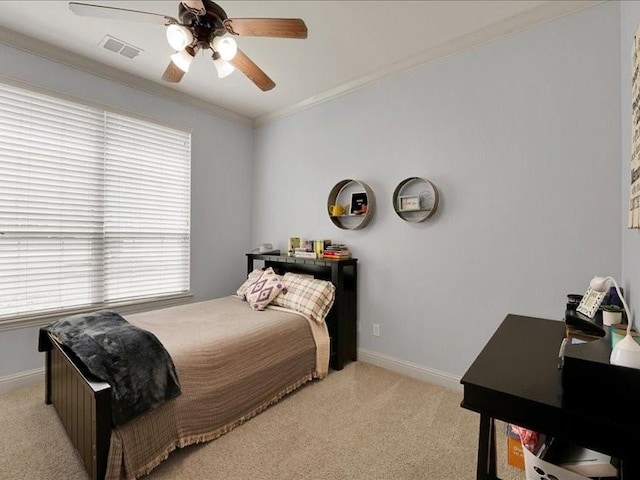 bedroom featuring light colored carpet, visible vents, crown molding, and baseboards