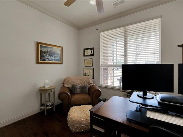 office space featuring dark wood-style floors, ceiling fan, crown molding, visible vents, and baseboards