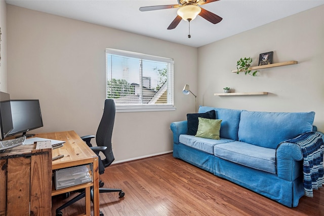 home office featuring baseboards, wood finished floors, and ceiling fan