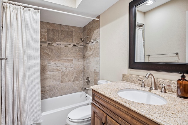 bathroom with toilet, shower / bath combo, and vanity
