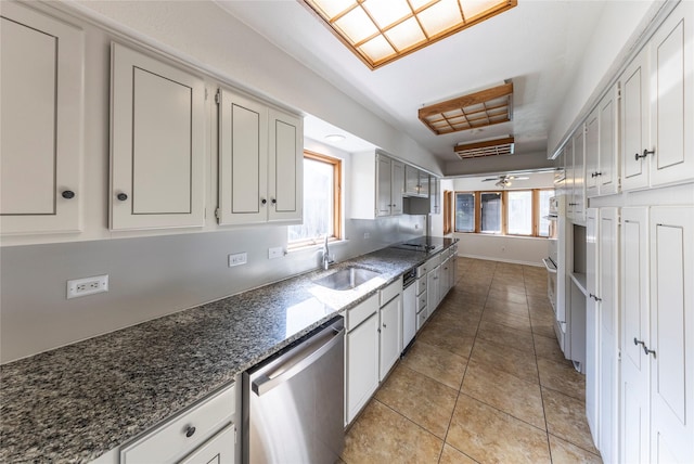 911 Prestwick Ln, Richardson, TX 75080 - kitchen with dark stone counters, a sink, light tile patterned flooring, ceiling fan, and dishwasher