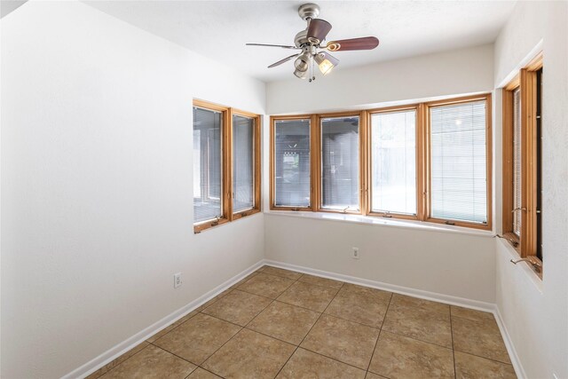 911 Prestwick Ln, Richardson, TX 75080 - unfurnished room with light tile patterned floors, a ceiling fan, and baseboards