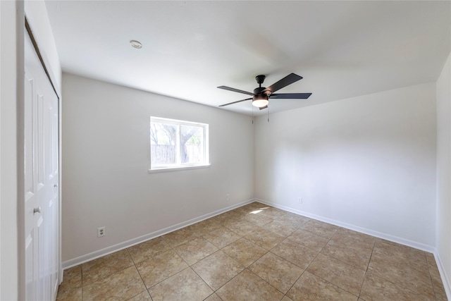 911 Prestwick Ln, Richardson, TX 75080 - unfurnished room featuring light tile patterned floors, a ceiling fan, and baseboards