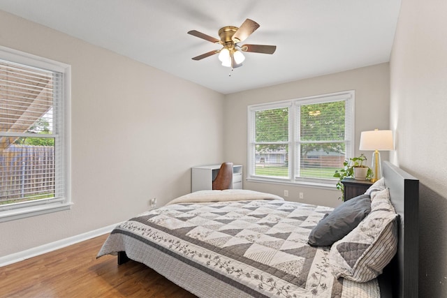 1701 W Birge St, Sherman, TX 75092 - bedroom featuring wood finished floors, baseboards, and a ceiling fan