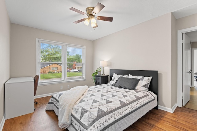 1701 W Birge St, Sherman, TX 75092 - bedroom with baseboards, wood finished floors, and a ceiling fan