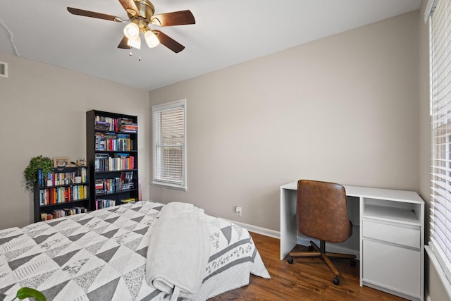 1701 W Birge St, Sherman, TX 75092 - bedroom with wood finished floors, a desk, baseboards, and a ceiling fan