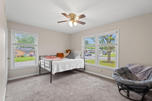1701 W Birge St, Sherman, TX 75092 - carpeted bedroom with multiple windows, baseboards, and a ceiling fan